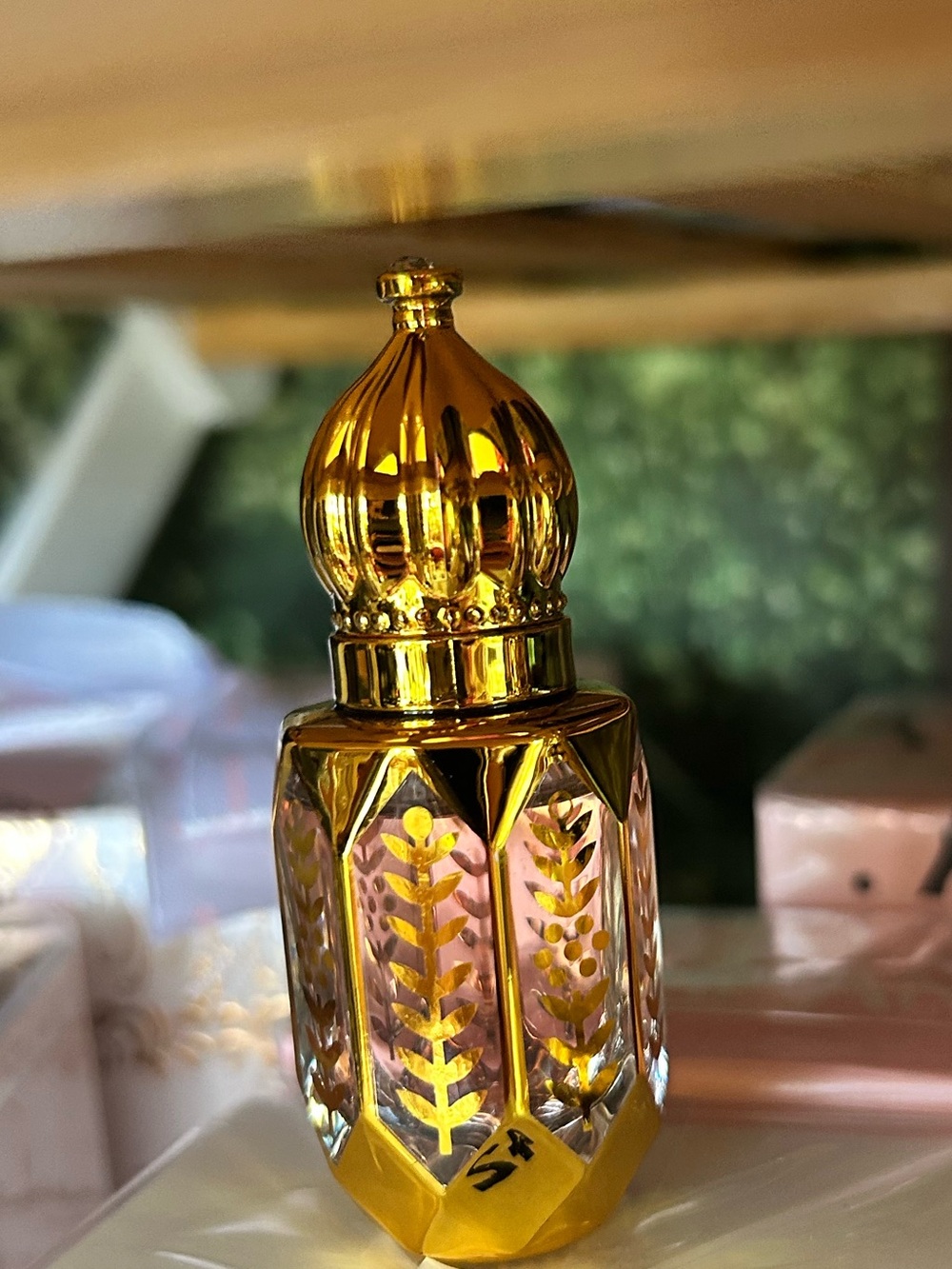 Ornate glass perfume dispenser.